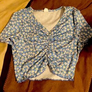 I am reselling a Teen Crop-Top. For ages 12-13Y. This floral shirt is from Shein